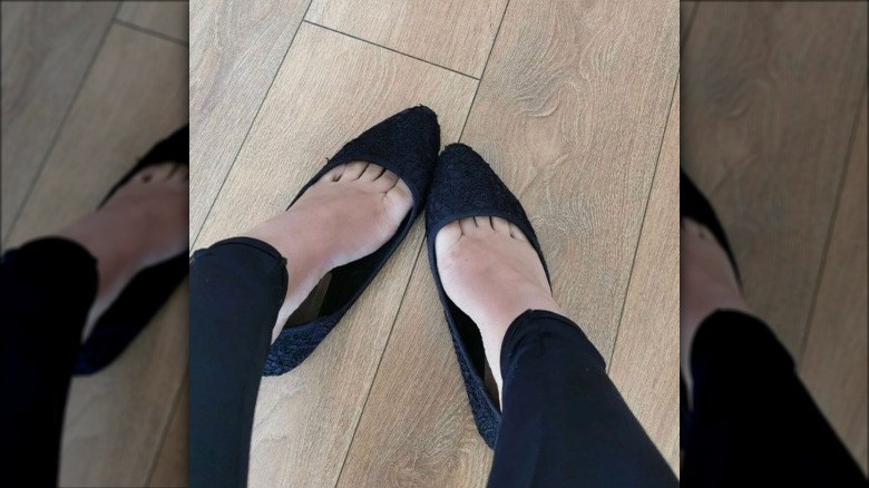 Woman wearing black textured heals