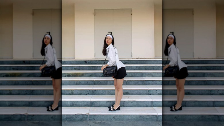 woman wearing outfit with black/white ballet pumps