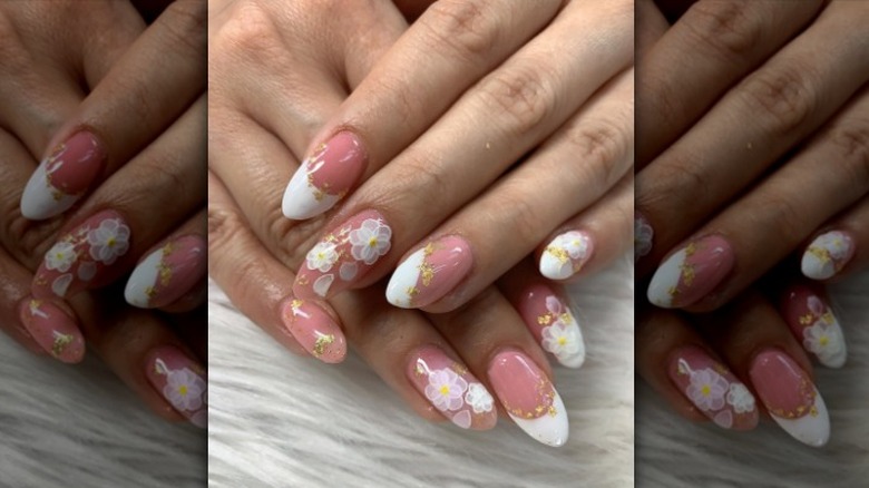 Pink nails with white designs