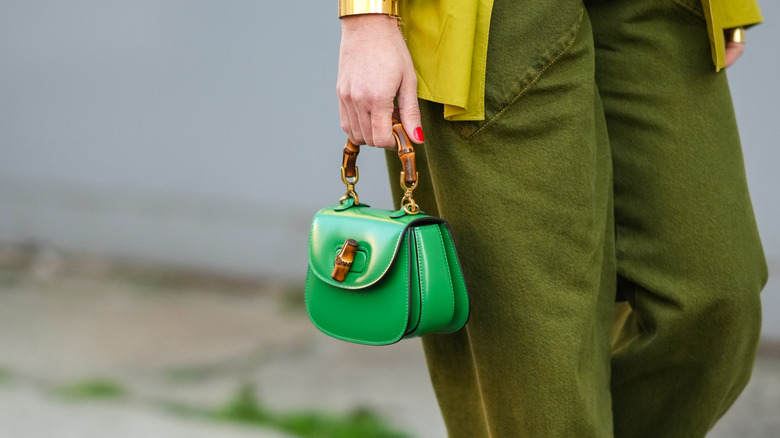 woman with micro bag and bamboo handles