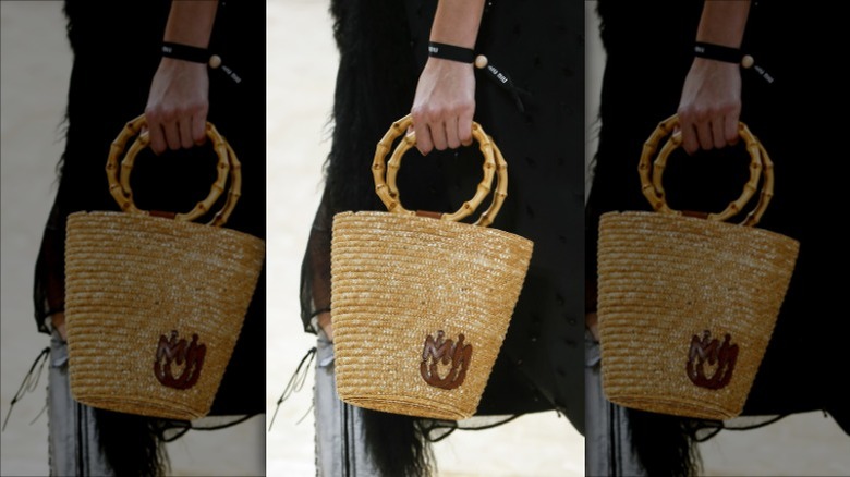 woman with straw bag and bamboo handles
