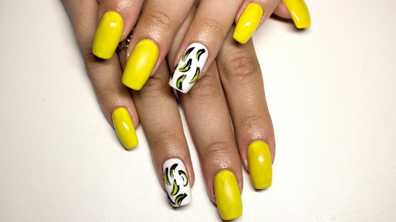 Yellow manicure with banana design