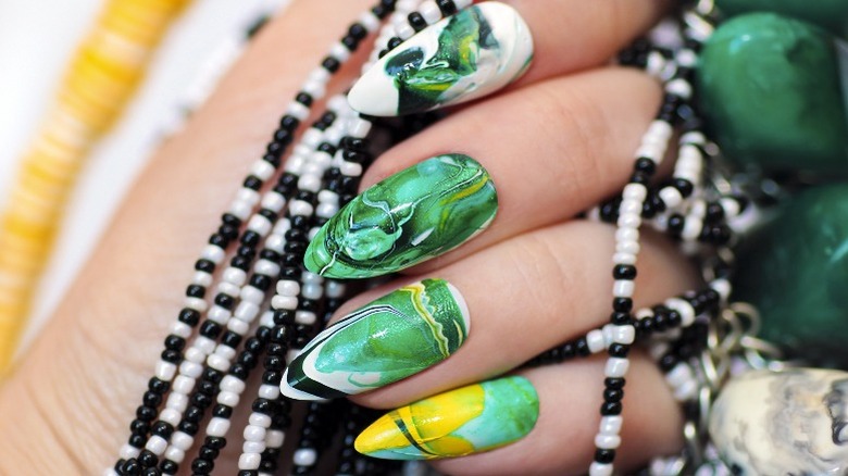 Green and yellow marbled manicure