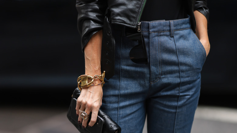 woman with chunky gold cuff 