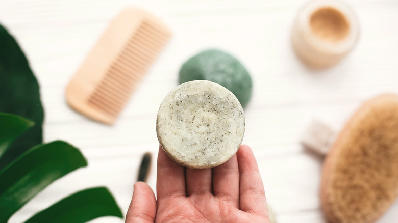 person holding shampoo bar