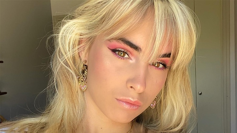 woman wearing glittery pink makeup