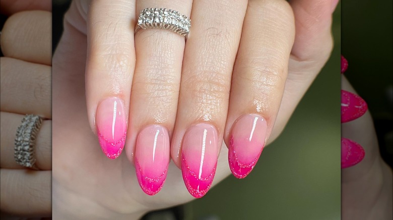 Soft pink into hot pink ombre nails with glitter details