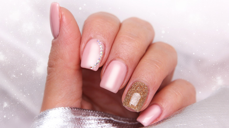 Pink manicure with gold metallic