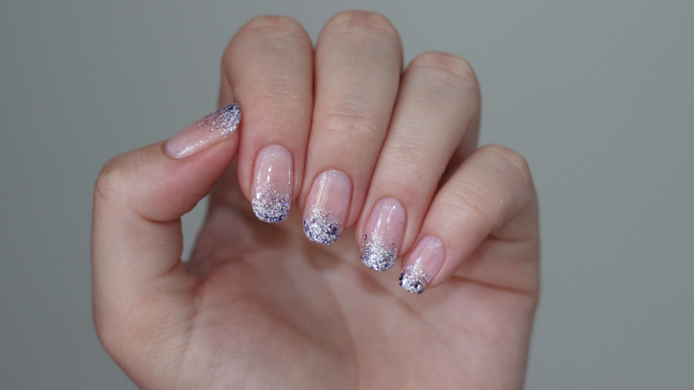 Pink manicure with glitter tips