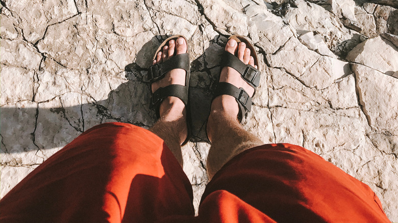 Woman looking down at Birkenstocks