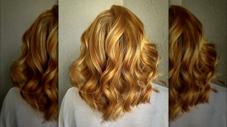 A woman with copper highlights