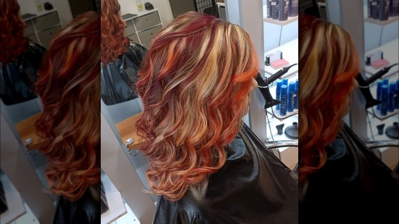 A woman with shades of red highlights