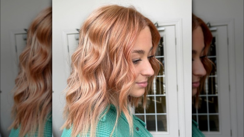 A woman with strawberry blond highlights