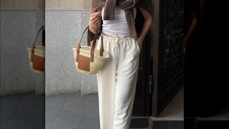 Girl holding mini Loewe tote