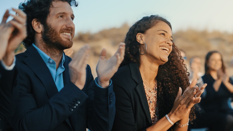 wedding guests clapping