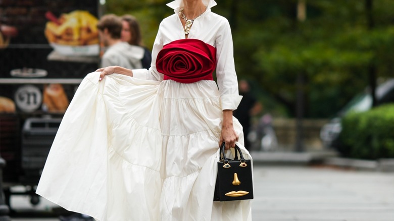 woman in rose applique dress