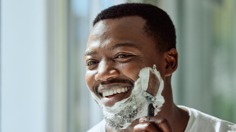 Man shaving beard