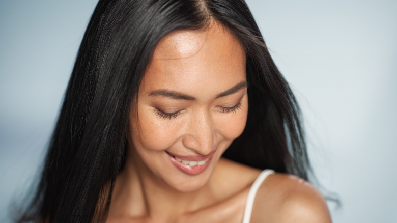 Woman with hydrated glowing skin