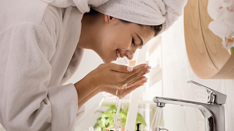 Woman washing face 