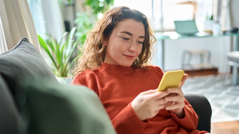 Woman researches on cell phone