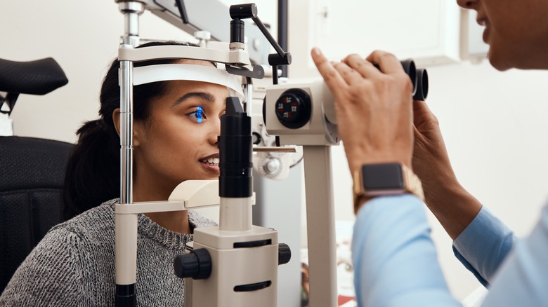 Woman has eye professionally examined