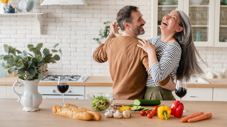 couple dancing in kitchen