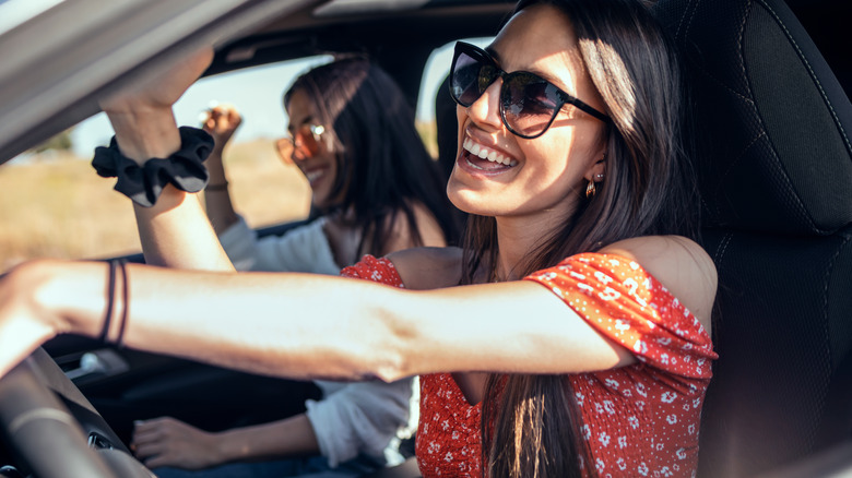 women driving with windows down