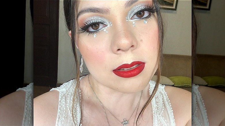 woman with silver jewel eye makeup