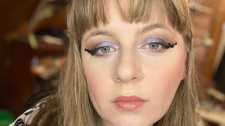 woman with bejeweled winged eyeliner