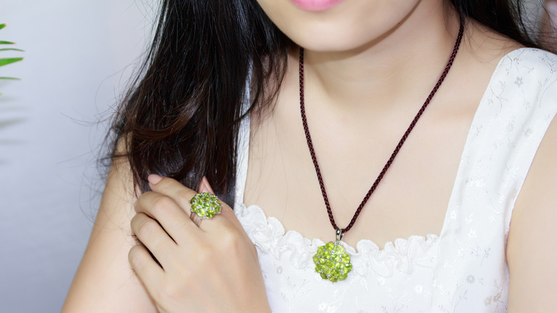 woman in peridot jewelry