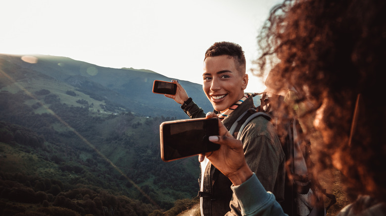 two hikers taking photos