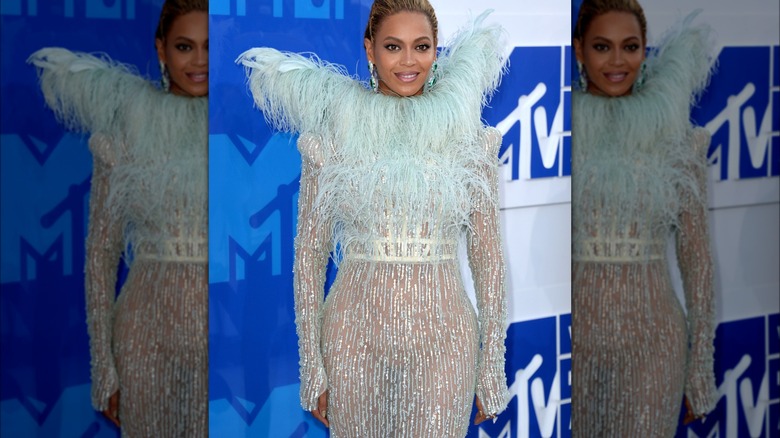 Beyonce silver and blue feather dress