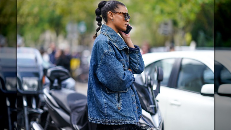 woman in denim jacket