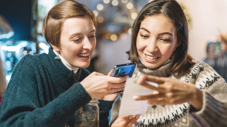 Women taking photo receipt