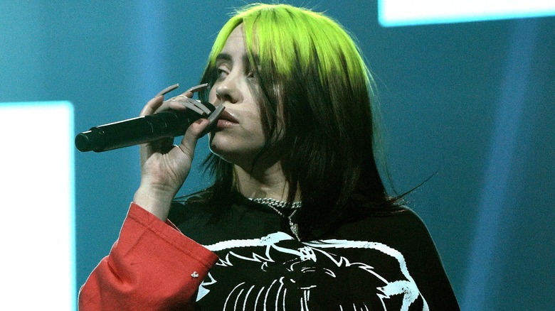 Billie Eilish with dyed green roots