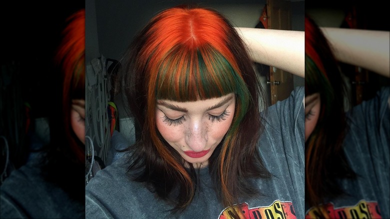 dyed orange roots on brown hair