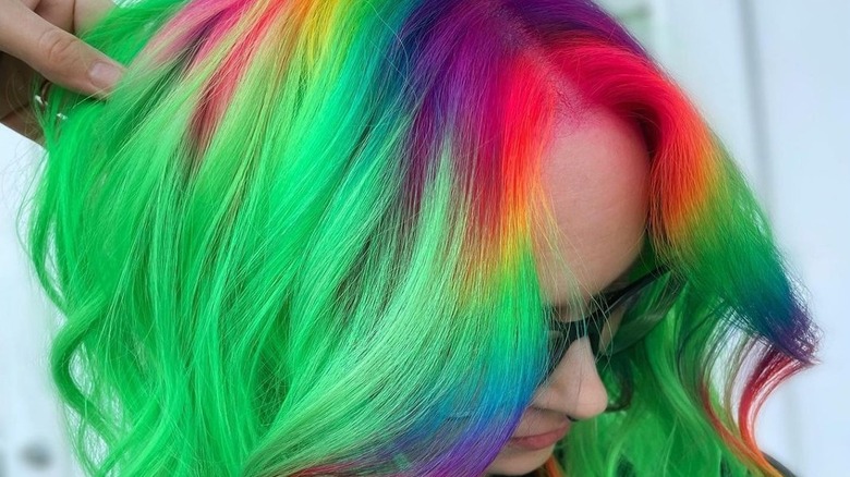 rainbow-dyed roots on green hair