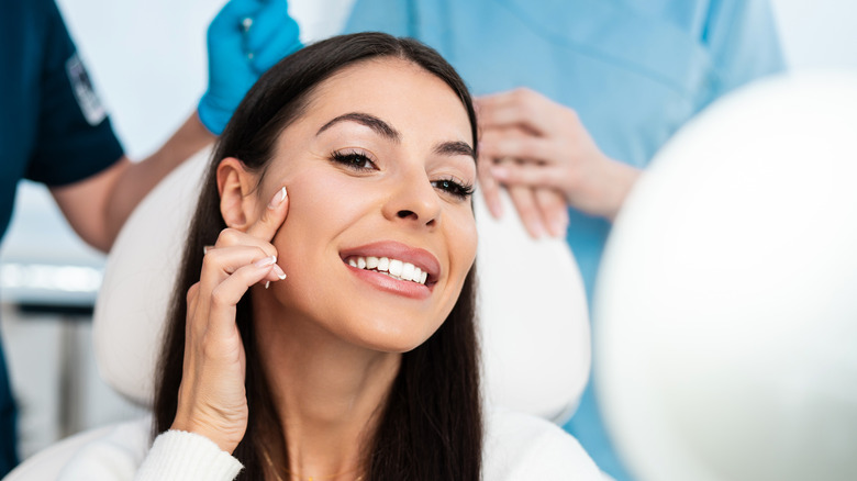 woman smiling after cosmetic procedure 