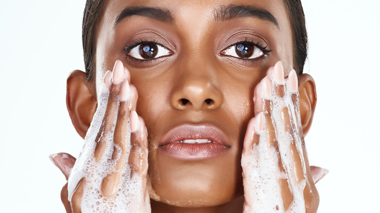 woman washing face 