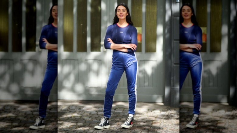 Woman wearing tracksuit and sneakers