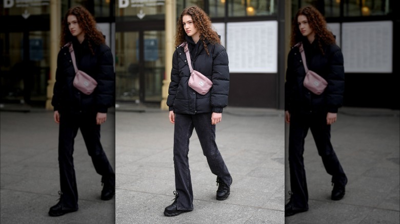 Young woman in black puffer jacket