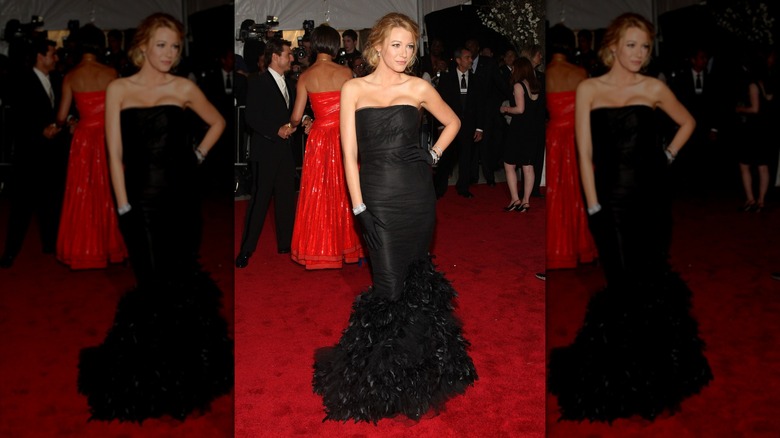 Blake Lively in a black Ralph Lauren dress with feather embellishments