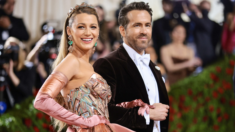 Blake Lively linking arms with Ryan Reynolds at the 2022 Met Gala