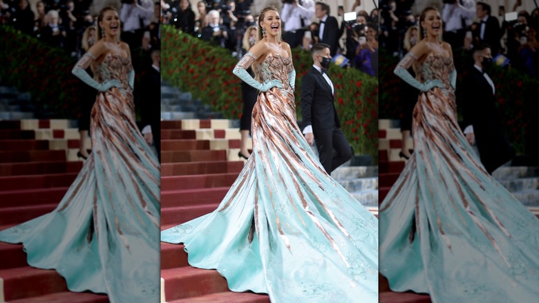 Blake Lively posing in her Lady Liberty dress on the Met Gala steps