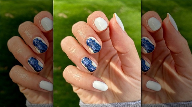 manicure with two blue agate nails