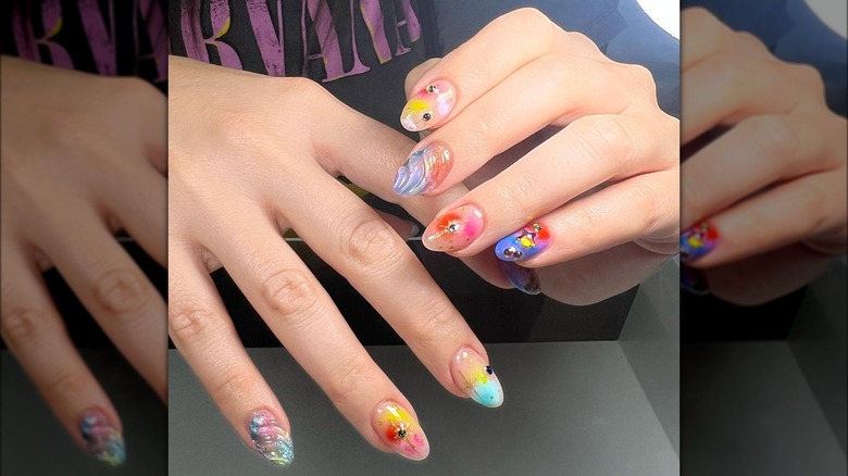 multicolored rounded nails with gems