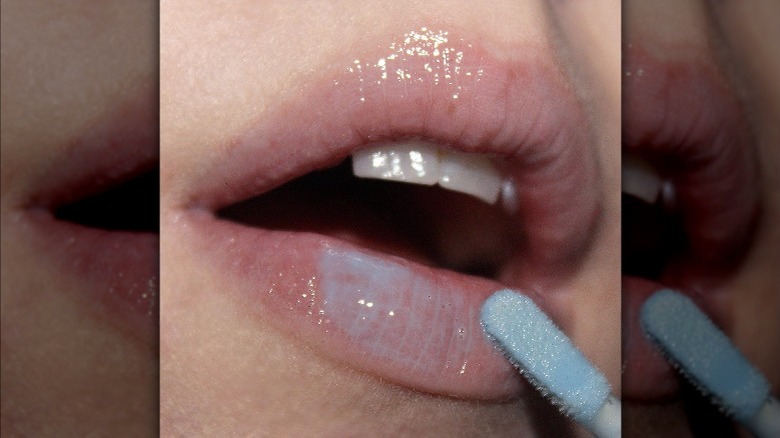 Instagram user @tooleybeauty using blue lipgloss