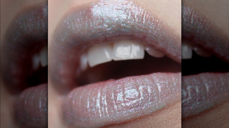 Instagram user @tooleybeauty with glitter blue lipgloss