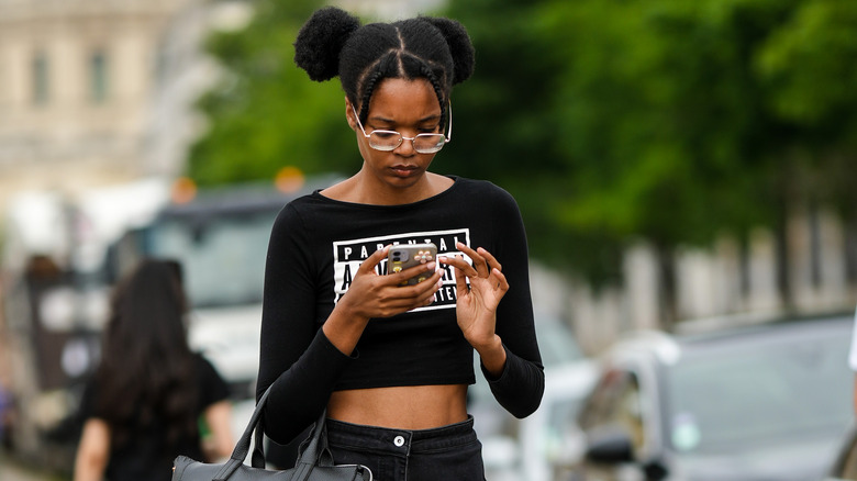 woman in boat neck crop top