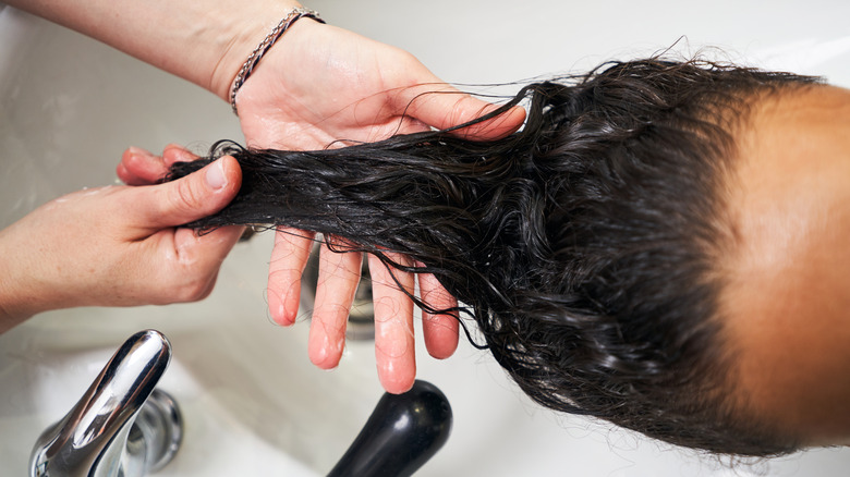 woman getting hair washed